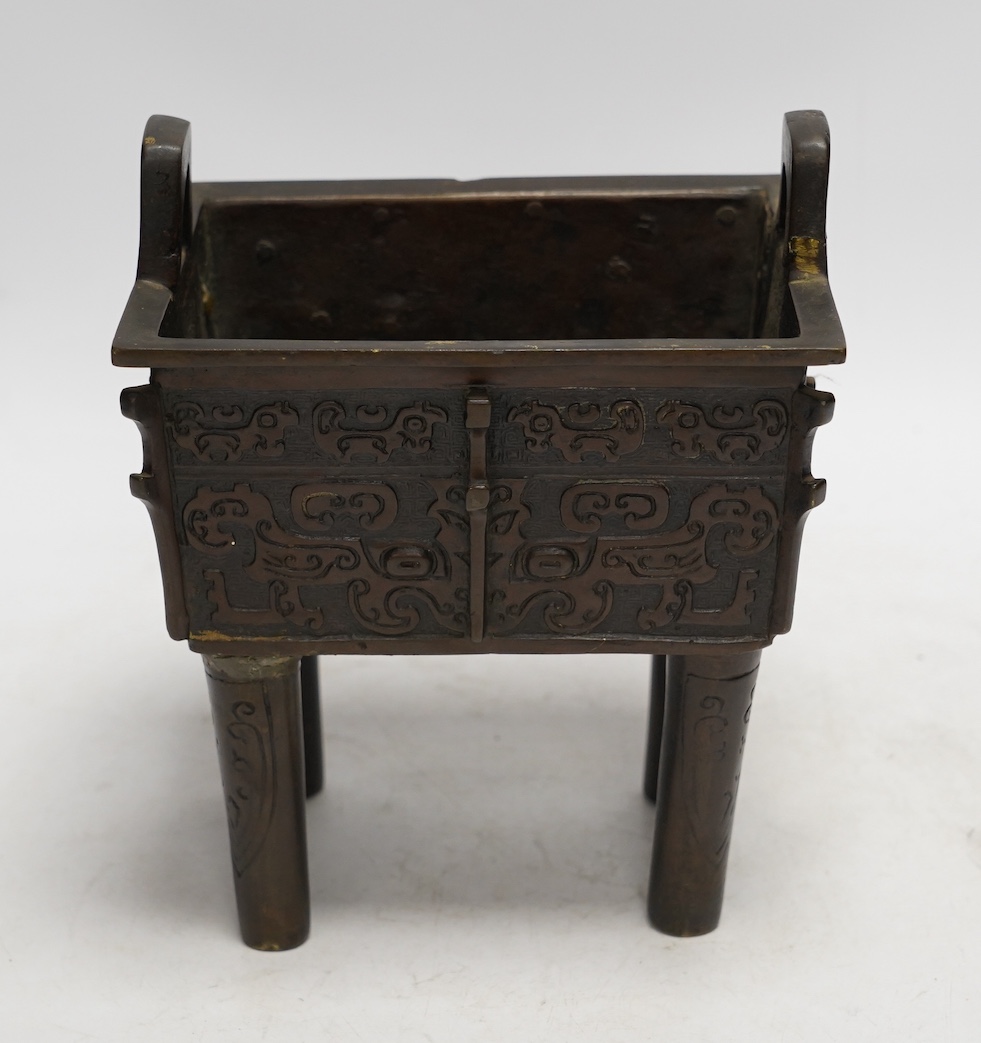 A Chinese archaistic bronze censer, fangding, Ming dynasty, repairs, 20cm